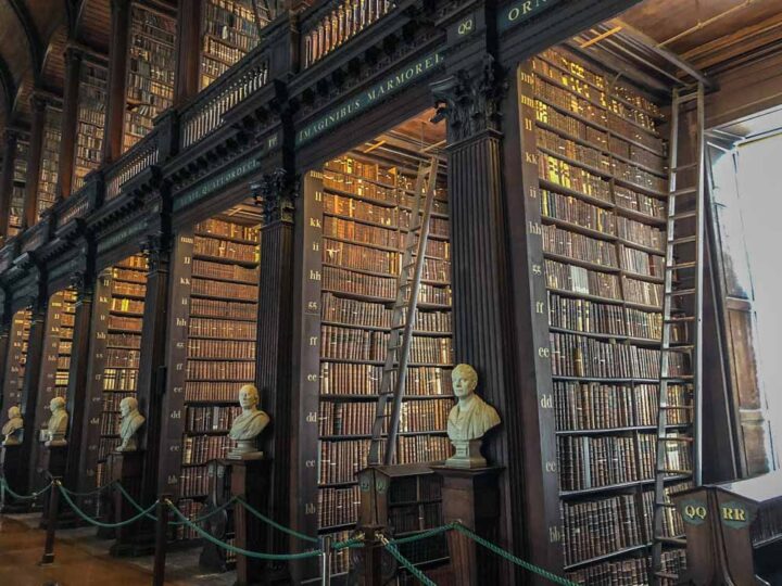 Dublin Ireland itinerary- Trinity College long library bookshelves with white statues