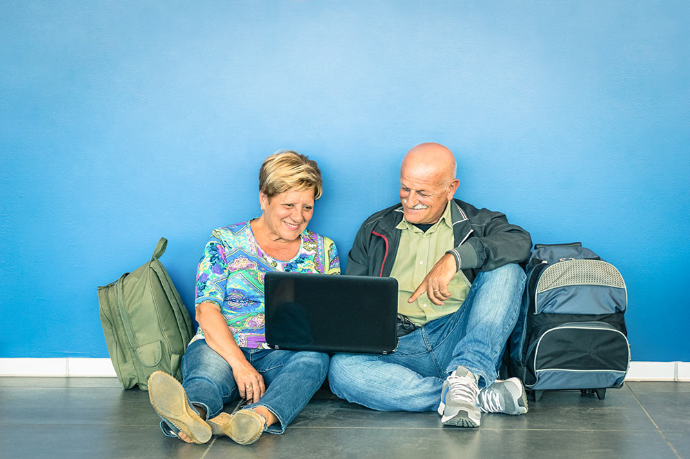 VPN protect data while traveling. Man and woman with luggage