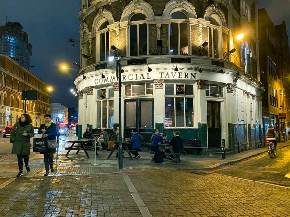 Shoreditch Pubs: Commercial Tavern. Street scene with pub and tables