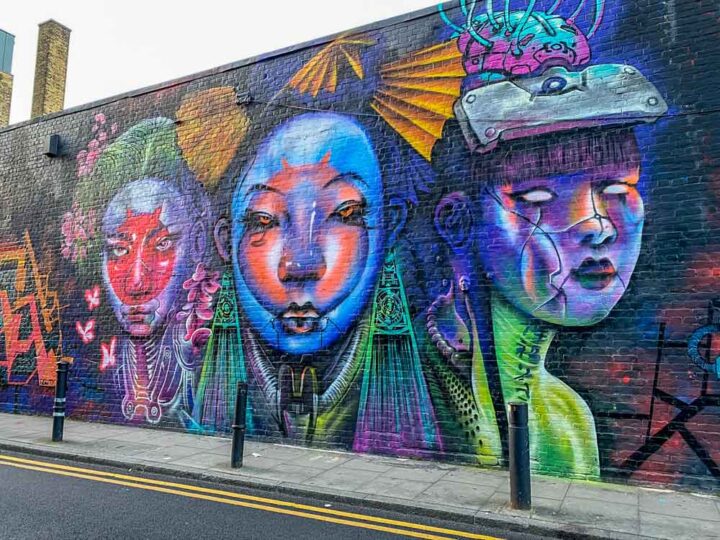 Shoreditch Brick Lane Mural on Hanbury St. Purple female figures