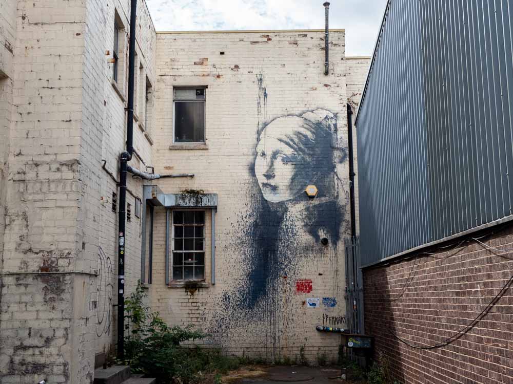 Banksy Bristol stencil girl with the pierced eardrum