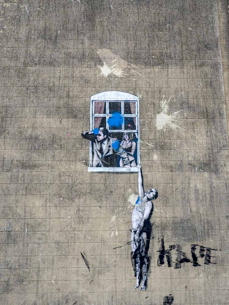 Well Hung Lover stencil seen on a Banksy street art tour in Bristol