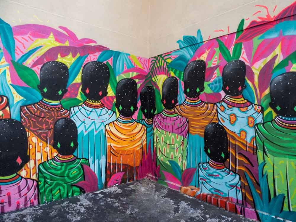 Street art in Paris Belleville. Colorful batik figures By Toz FBC