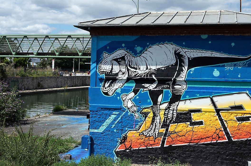 Saint Denis Canal in Paris: dinosaur mural
