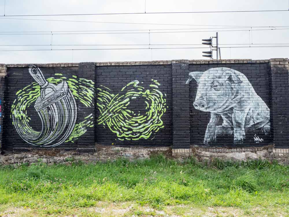 Tallinn Telliskivi parking lot pig and paint brush mural