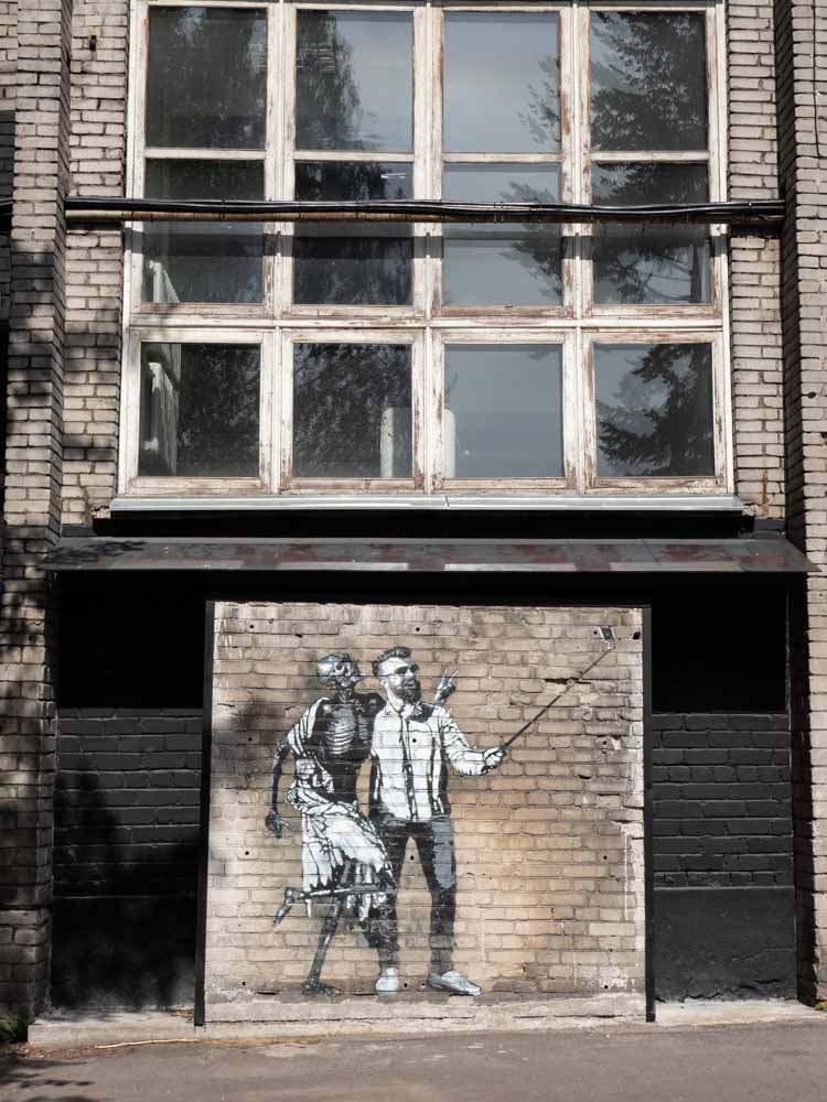 Tallinn Estonia street art stencil selfie and skeleton