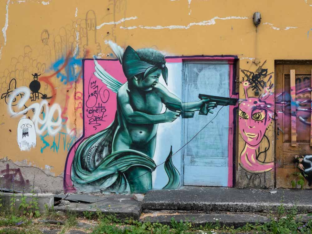 Tartu Karlova graffiti character with gun