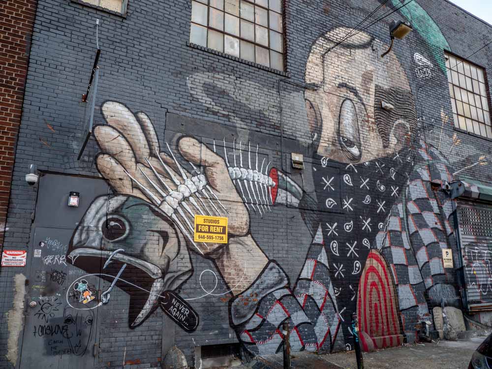 Street art NYC by Dis-satisfied man with fish