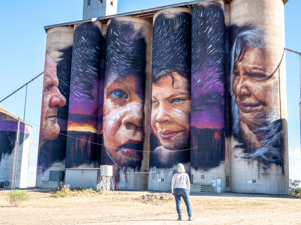 Sheep Hills silos by Adnate. Four aboriginal Australians with a purple mural