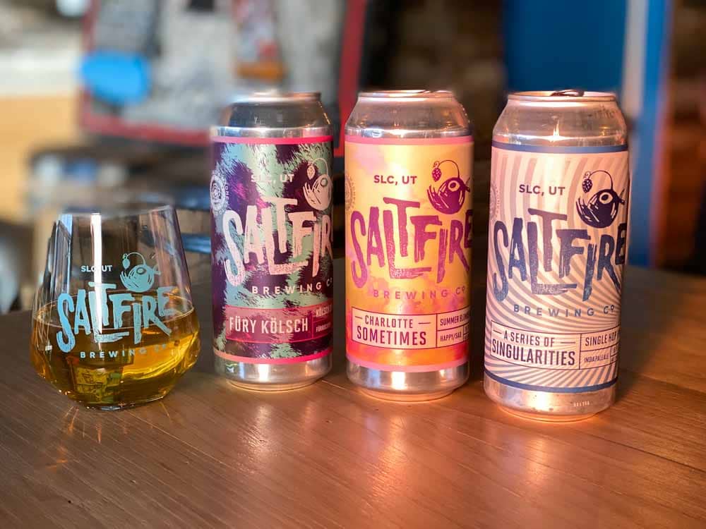 Saltfire brewing Salt Lake. Cans and a glass of beer