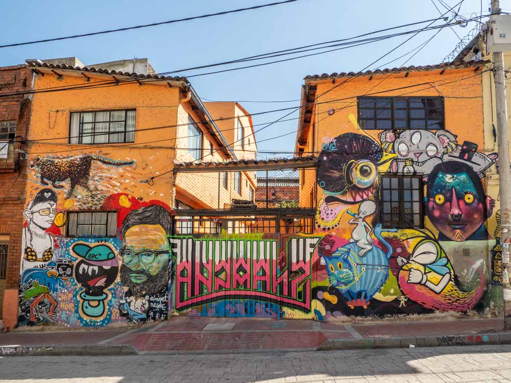 Bogota graffiti wall in La Calendaria. Graffiti, cheetah and faces in multi colors