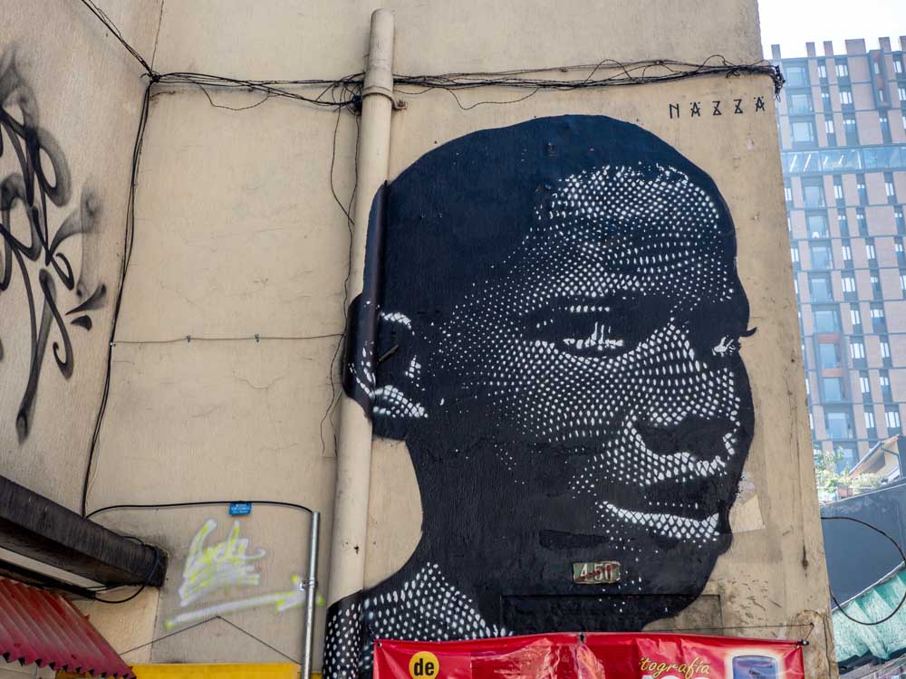 Bogota streetart by nazza malefigure. Black paint on building