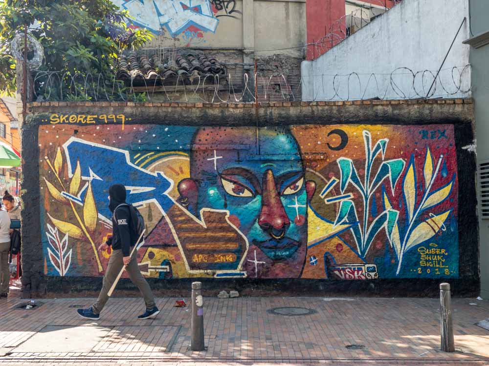 Bogota blue face mural by skore999