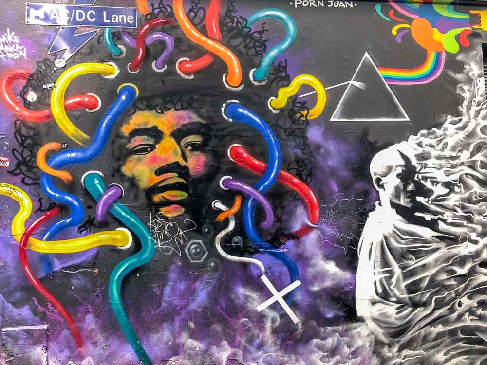 Melbourne Australia: Jimi Hendrix mural in ACDC Lane - with portrait and blue, purple and red tubes