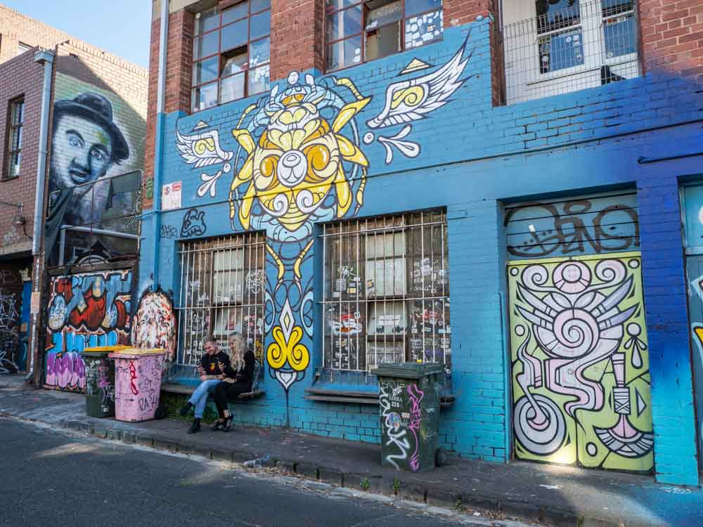 Juddy Roller in Melbourne. Mural by Phibs with blue and yellow characters