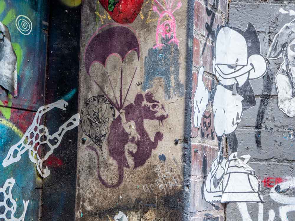 Melbourne Banksy stencil Duckboard place. Purple rat