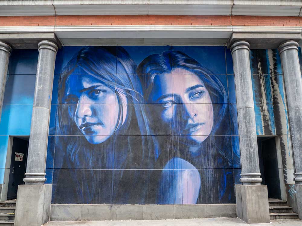 Melbourne Rone mural Southern Cross Station. two women in blue