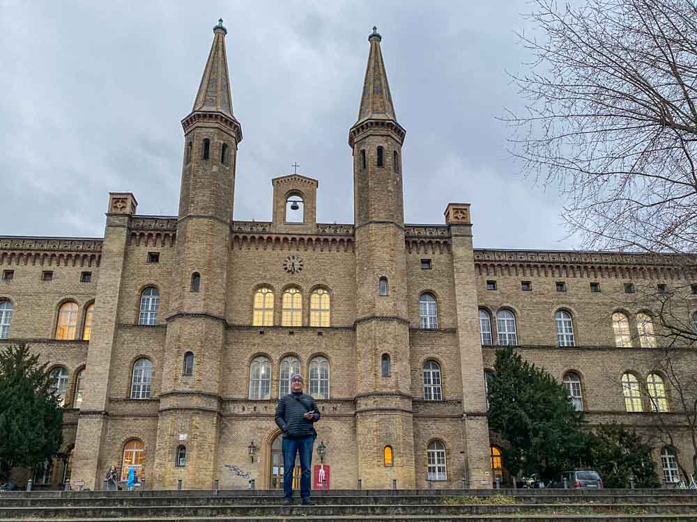 Berlin Bethanien art building Kreuzberg. Man standing in front of large brick building