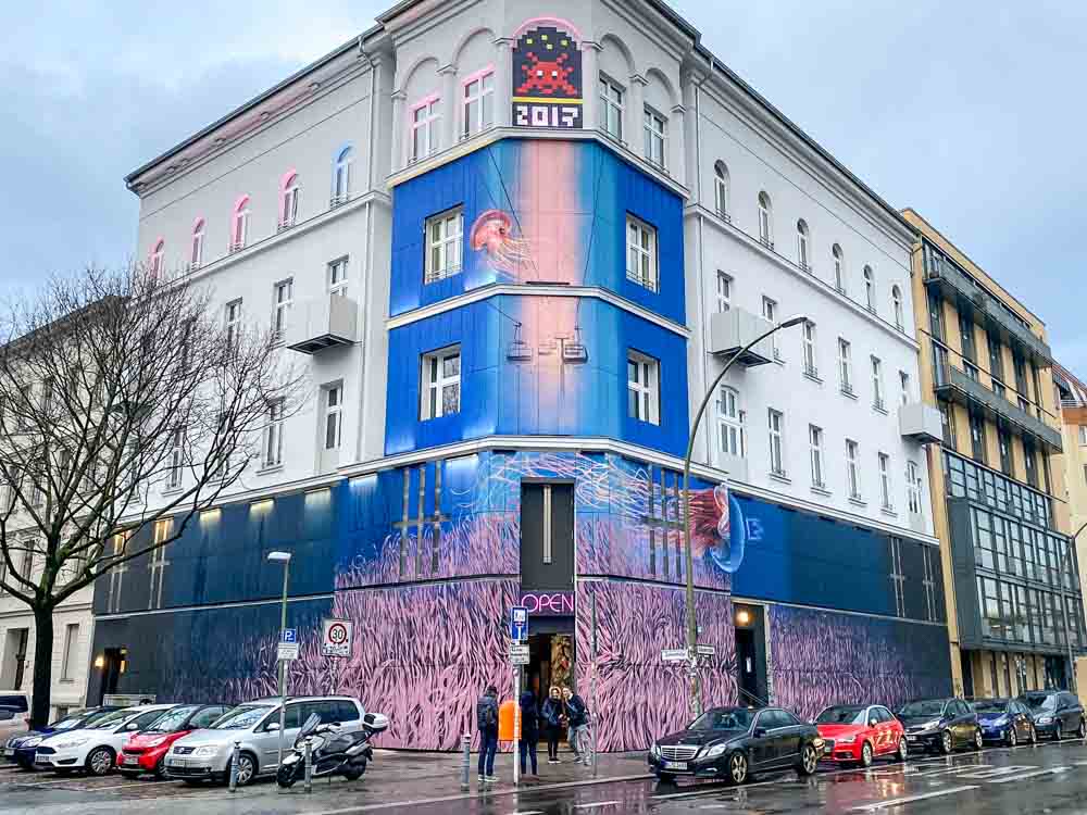 Berlin Urban Nation street art museum. building with blue and pink mural