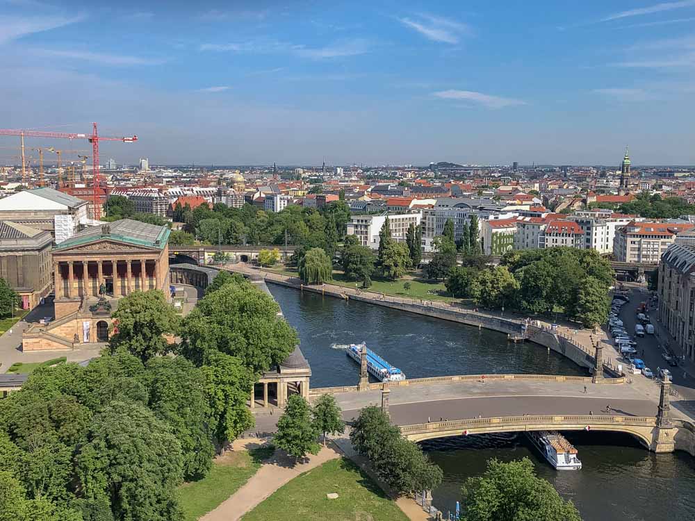 Berlin city view from Berliner Dom - a bridge and river with rooftops