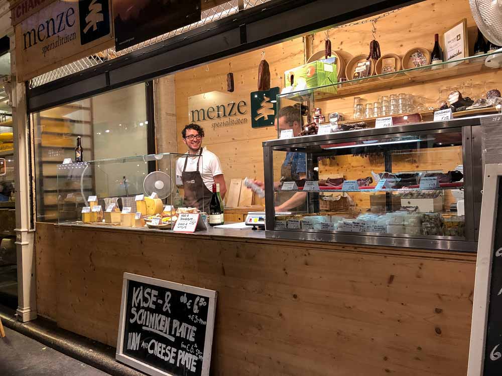 cool stuff to do in Berlin Germany Street Food Thursday- cheese booth with man