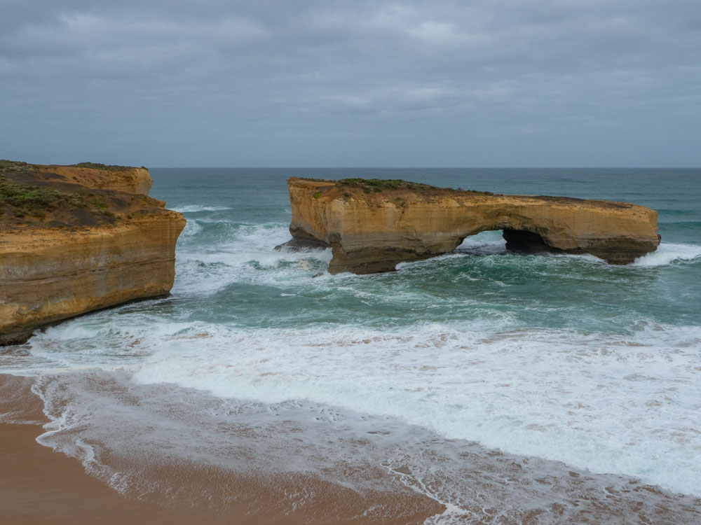Australia's London Bridge on the Great Ocean Road. Limestone arch and rocks with ocean waves