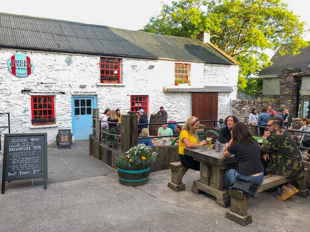 Dick Mac brewery in DIngle Ireland. People on a patio drinking beer