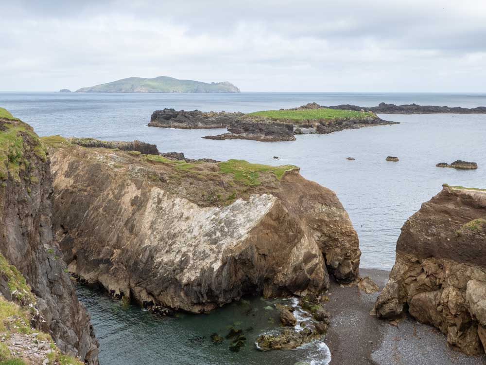Ireland Great Blasket Island shoreline. Rocks with ocean and islands