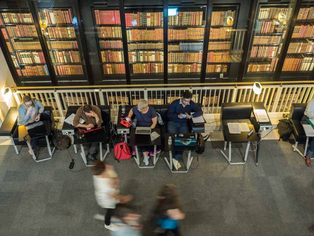 London's British Library stacks. People reading and walking by