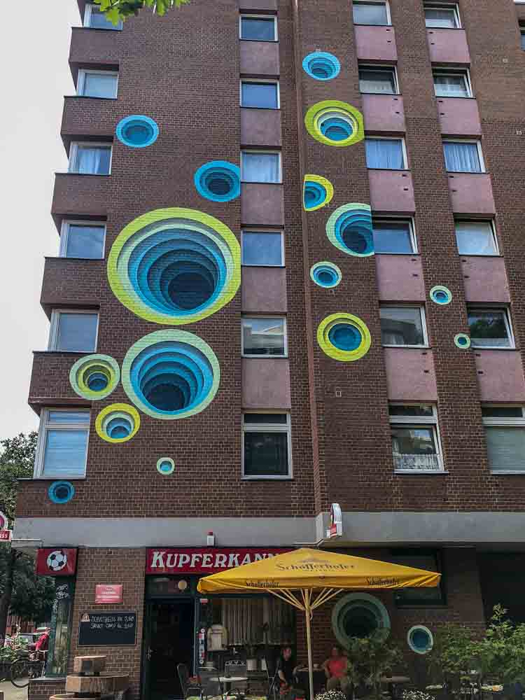 1010 mural in Berlin Shoenberg. blue and green circles