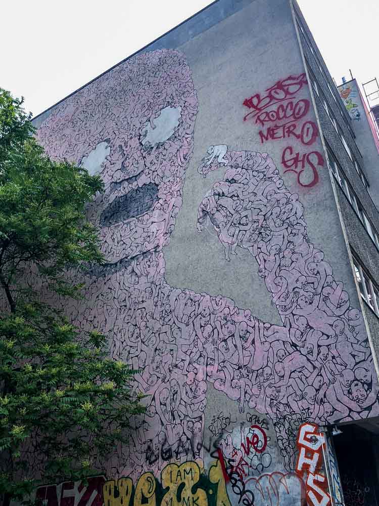 Kreutzberg Berlin street art mural by Blu- Pink Man