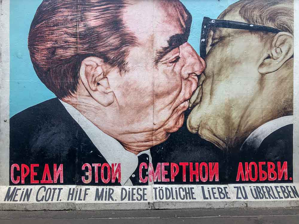 Berlin East Side Gallery Fraternal Kiss Dmitri Vrubel. two men kissing