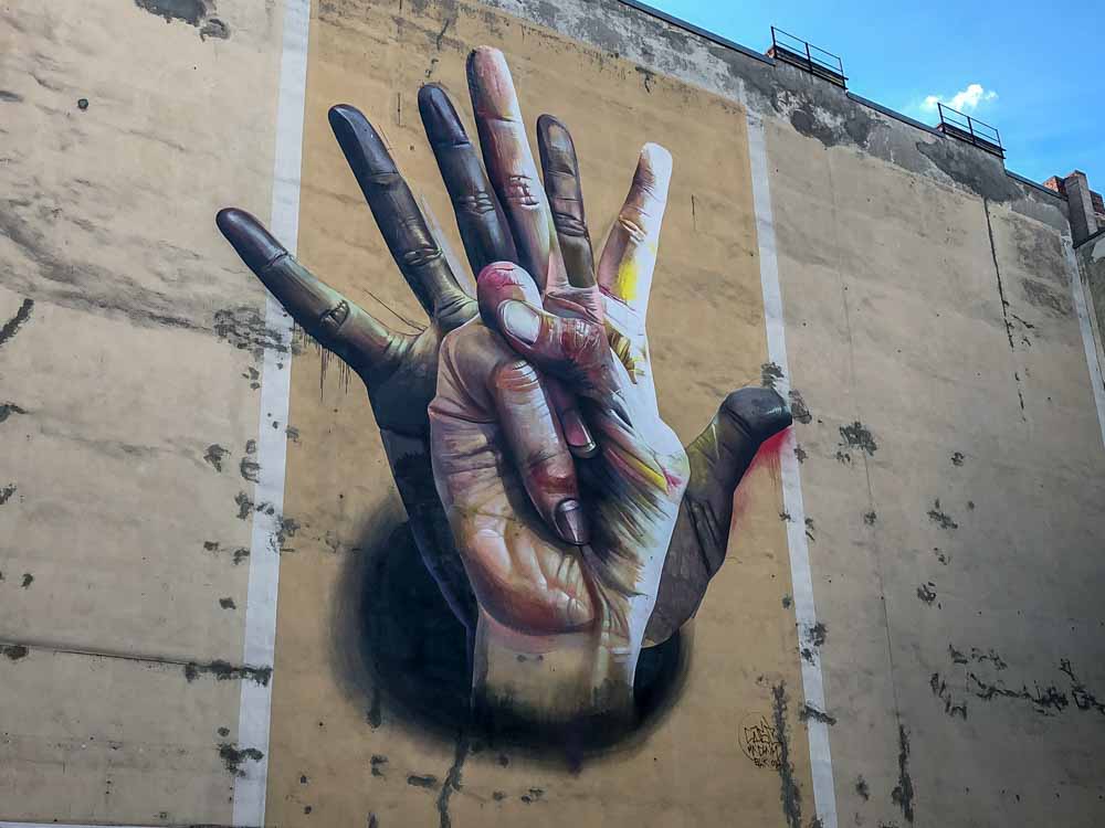 Berlin mural by Case. Two hands
