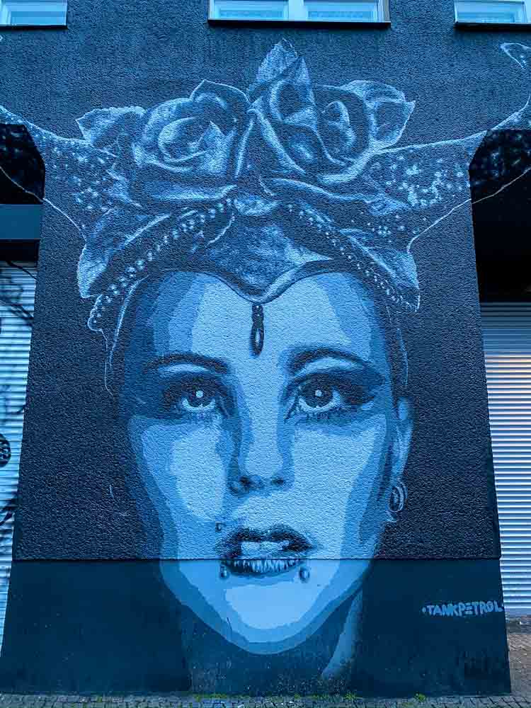 Schoneberg Berlin mural Tank Petrol. blue mural of a woman