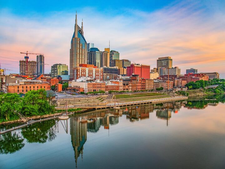 Nashville City skyline dusk. buildings and water reflection