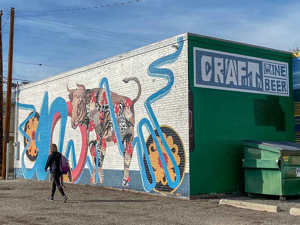 Craft Beer and Wine mural by Nanook in Reno Nevada. Mural with woman walking