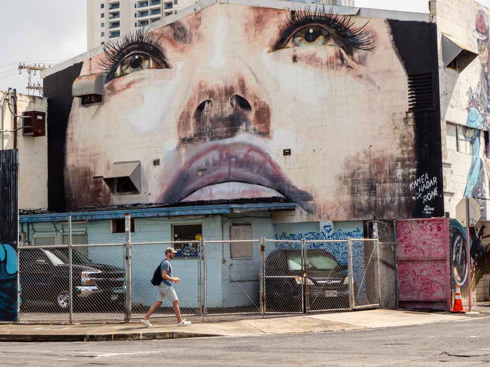Rone and Kamea Hadar mural in Kakaako Honolulu. Mural of a woman's face