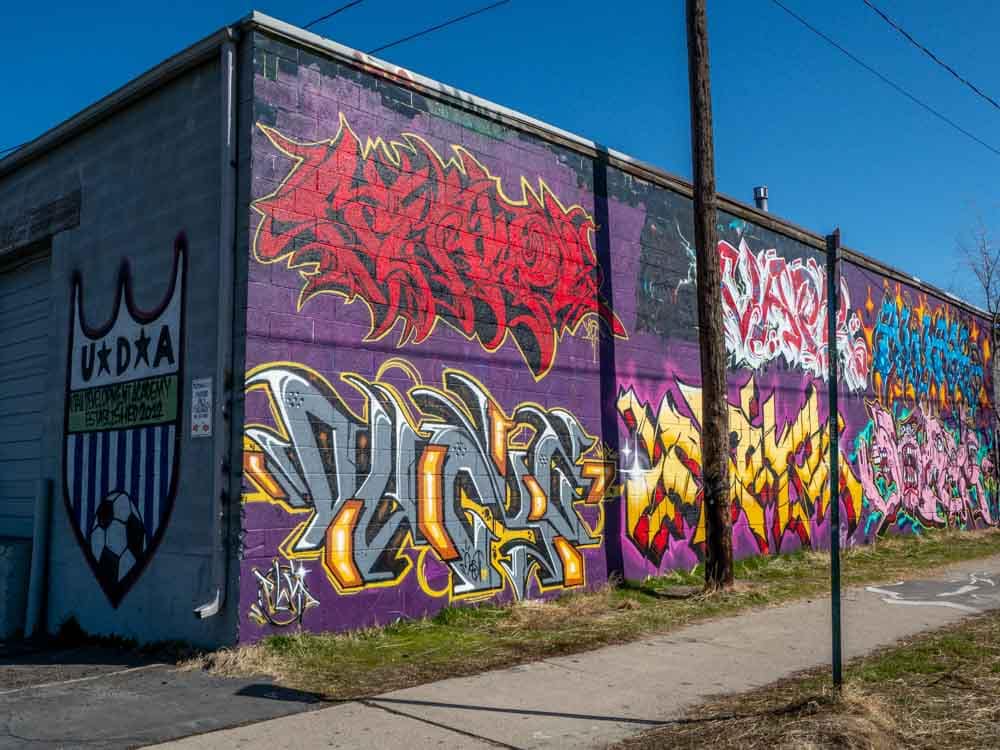 Salt Lake City wildstyle graffit. Red purple and yellow lettering