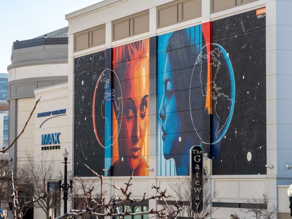 Salt Lake City Gateway center mural by dourone. Two Faces Earth. blue and orange