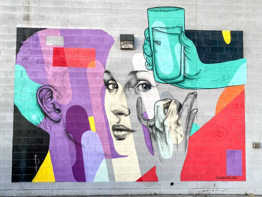 Chuck Dillah Mural in Salt Lake CIty. Face with water glass