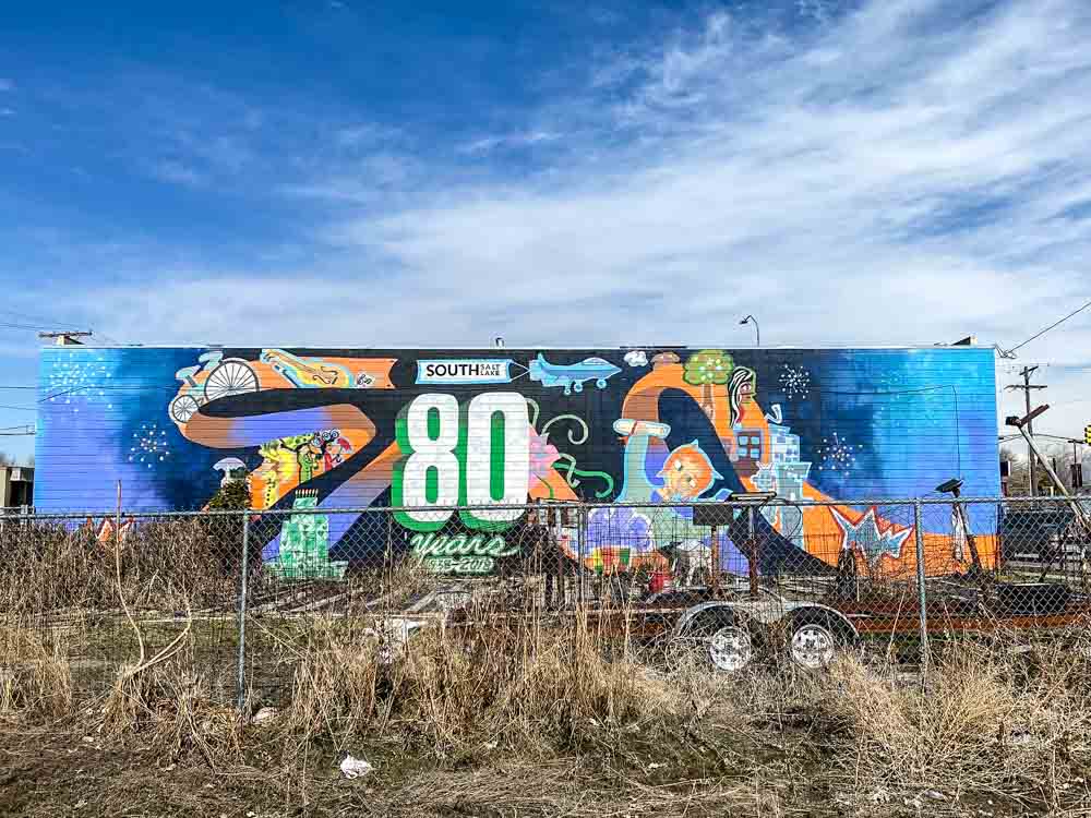 South Salt Lake City street art 80 years: mural and weeded lot