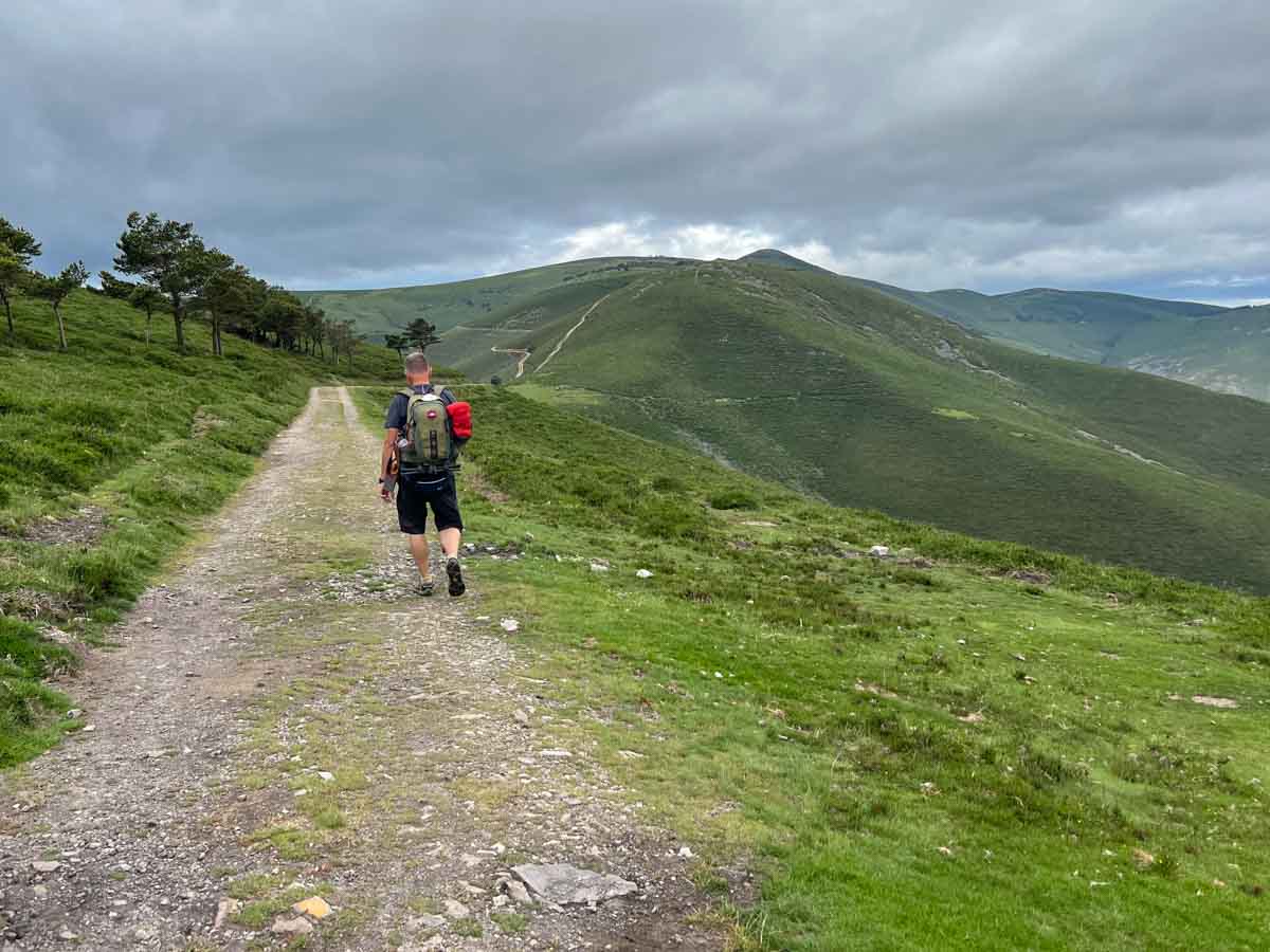 Camino de Santiago Hospitales route Primitivo. Hiker in mountains