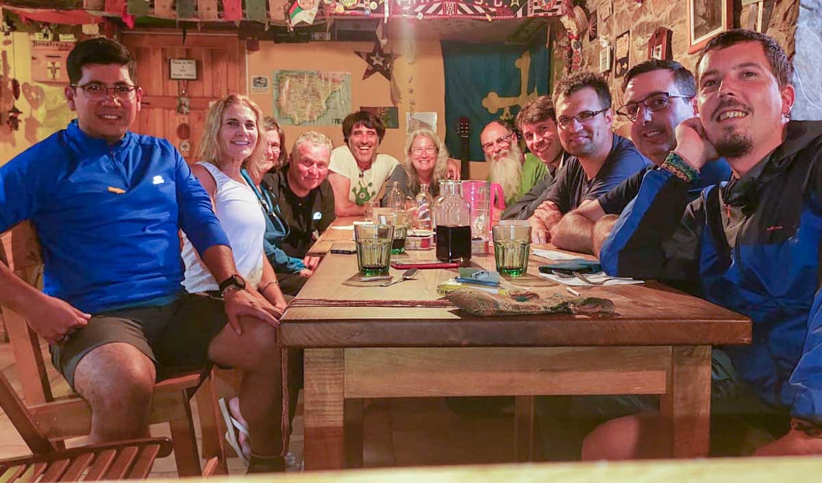 Camino albergue at Bodenaya. Group eating dinner