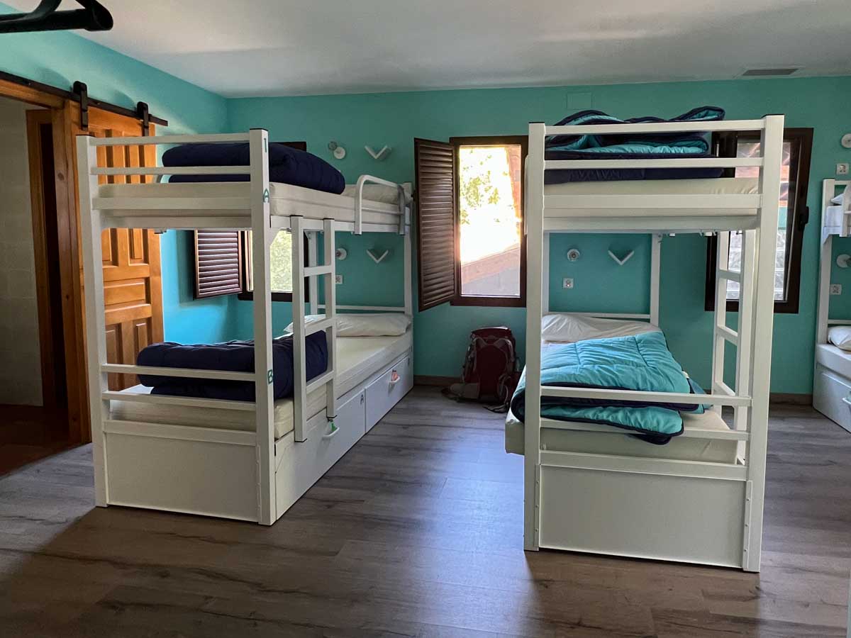 Camino Primitivo albergue at Palatin. four bunkbeds and a window